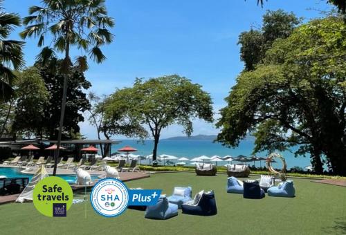 a resort with a view of the water at Cosy Beach Hotel - SHA Extra Plus in Pattaya South