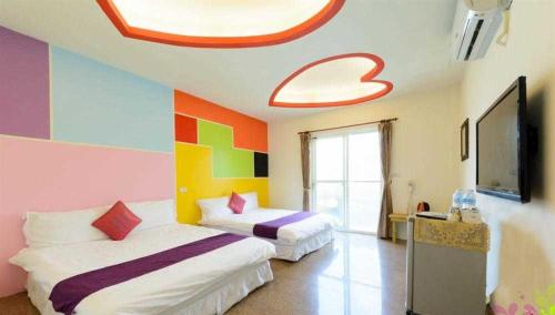 Llit o llits en una habitació de Blue% Hotel