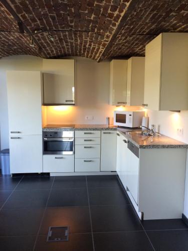 Una cocina o zona de cocina en Gite des étangs à Montzen