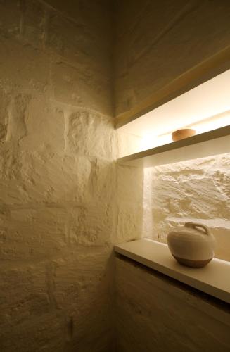 a vase sitting on a shelf in a room at The King George Village Boutique Living in Għargħur