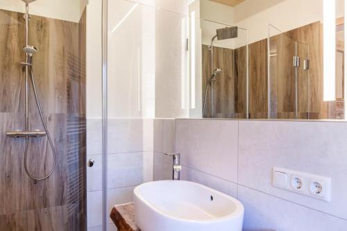 a bathroom with a sink and a shower at Ferienwohnung Karwendelblick in Jachenau