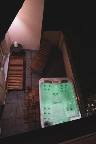 an overhead view of a bath tub with two benches at Boutique Hotel U zvonku in Třeboň