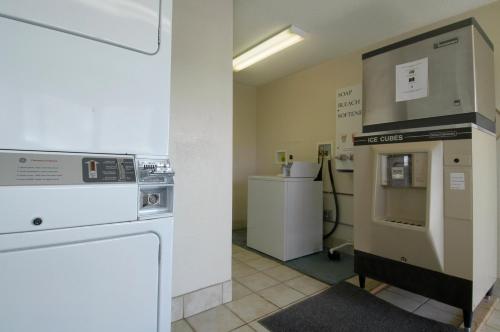 
a kitchen with a refrigerator and a microwave at Red Roof Inn Cleveland - Medina in Medina
