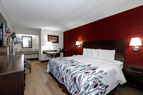 
a hotel room with two beds and a television at Red Roof Inn Cleveland - Medina in Medina
