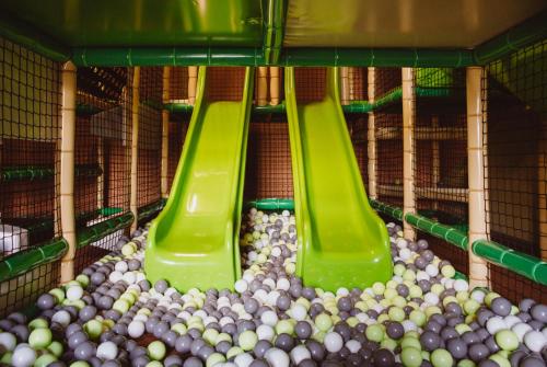 a bird cage filled with lots of balls at Folwark Łochów in Łochów