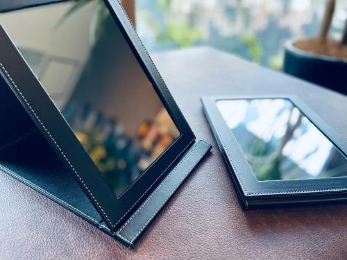 a mirror sitting on top of a table at hotel the textile in Gifu
