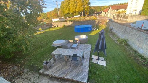 an overhead view of a backyard with a table and an umbrella at Studio 20 m2 in Chamouilley