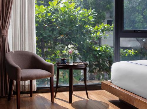 
a living room filled with furniture and a window at Oriana Boutique Hotel & Spa in Hanoi
