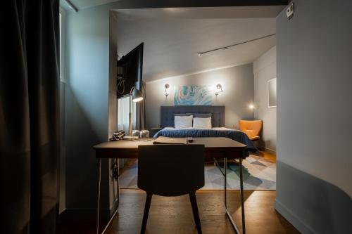Una cama o camas en una habitación de Hotel Poseidon