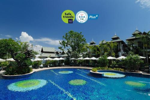 a pool at a resort with a sign that says she travels first at The Zign Hotel Premium Villa in North Pattaya