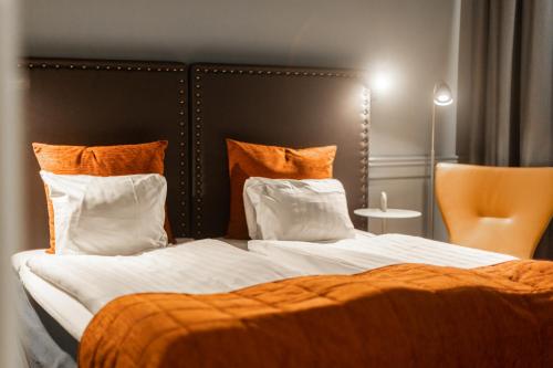 Una cama o camas en una habitación de Hotel Poseidon