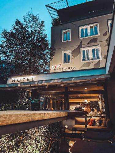 a hotel sign on the front of a building at Victoria - Alpine Boutique Hotel & Fine Dining in Meiringen