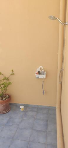 a corner of a room with a phone on the wall at Attico in centro con vista mare e monti! in Marina