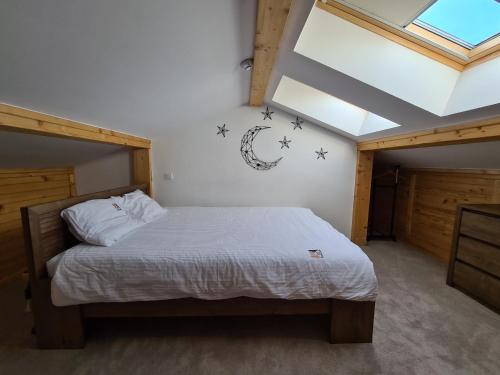 a bedroom with a bed with stars on the wall at Starloft Kopaonik in Kopaonik