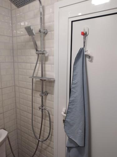 a bathroom with a shower with a shower curtain at Beach House Cabacum in Golden Sands