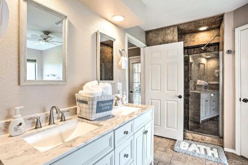 a bathroom with two sinks and a shower at Gainesville Home with Outdoor Oasis, 16 Mi to Lake in Gainesville