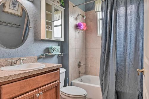 a bathroom with a sink and a toilet and a shower at Elegant Valrico Home about 15 Mi to Downtown Tampa! in Valrico