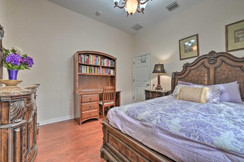 a bedroom with a bed and a book shelf at Elegant Valrico Home about 15 Mi to Downtown Tampa! in Valrico