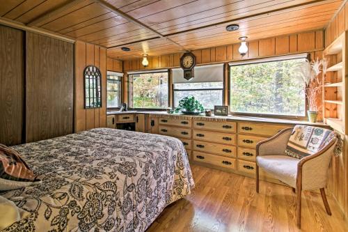 a bedroom with a bed and a desk and window at Cozy Retreat with Fire Pit Less Than 1 Mi to Mille Lacs Lake in Vineland