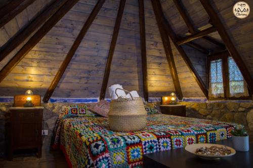 a bedroom with a bed in a attic at HAPPY GLAMPING MADONIE in Polizzi Generosa