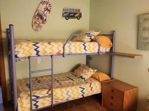 A bed or beds in a room at Piso Don Mateo en Sierra de Gredos
