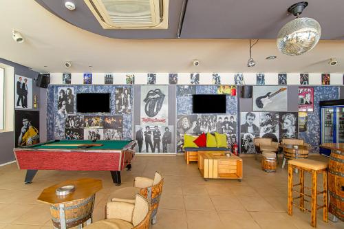 a billiard room with a pool table in the middle at Ilios Malia Hotel Resort in Malia