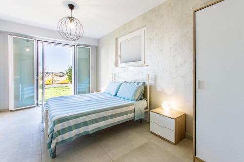 Postel nebo postele na pokoji v ubytování B&B Al Chicco d'Uva