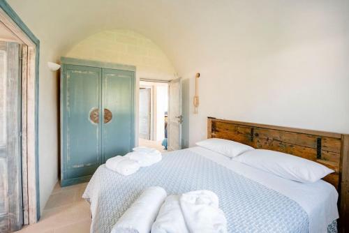 A bed or beds in a room at Trullo Lillo