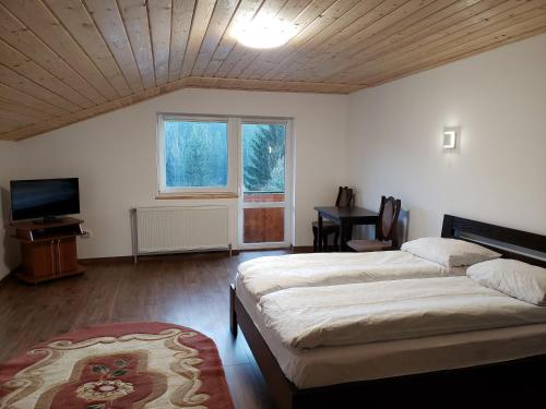 Ένα ή περισσότερα κρεβάτια σε δωμάτιο στο X-drive Apartments