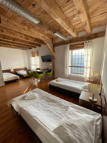 Postel nebo postele na pokoji v ubytování Hostel Międzynarodowe Centrum Spotkań Młodzieży