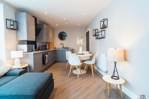 a living room with a bed and a kitchen at No Seven Harbour Side in Poole