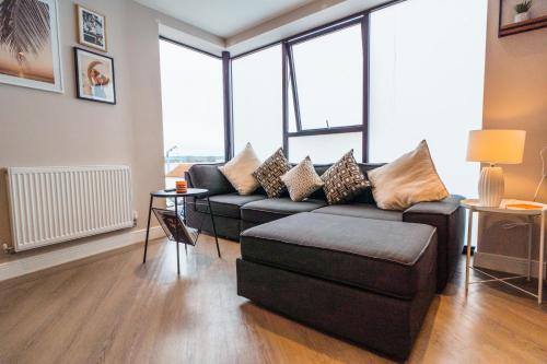 a living room with a couch and a chair at No Seven Harbour Side in Poole