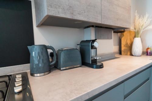 a kitchen counter with a toaster and a toaster at No Seven Harbour Side in Poole