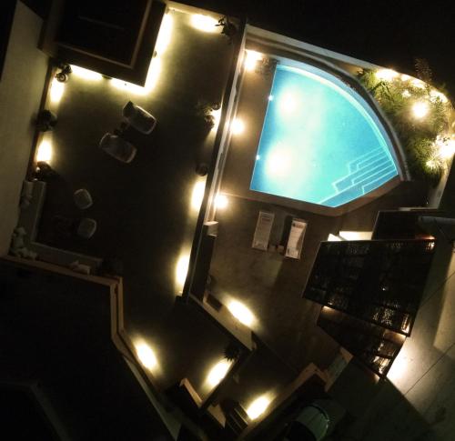 an overhead view of a swimming pool with lights at Potamos Luxury House, Private Pool, Santorini in Éxo Goniá