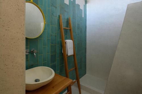 a bathroom with a sink and a mirror at Potamos Luxury House, Private Pool, Santorini in Éxo Goniá