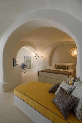 a bedroom with two beds in a white room at Potamos Luxury House, Private Pool, Santorini in Éxo Goniá
