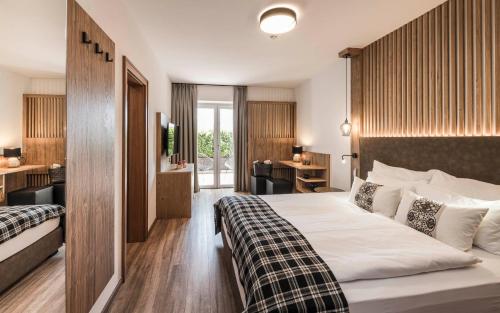 a hotel room with a bed and a desk at matill - timeless boutique retreat in Laces