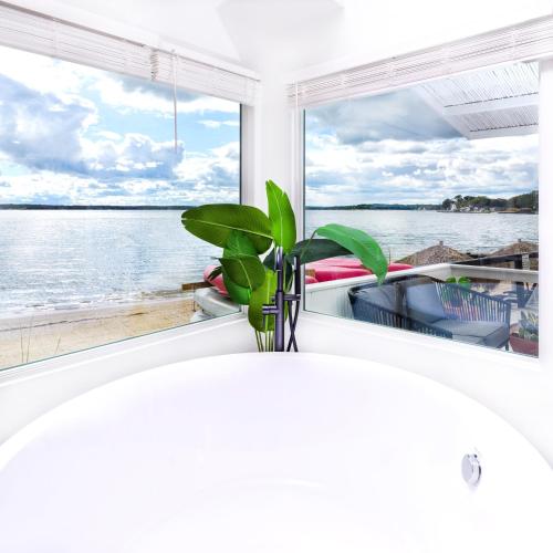 a window with a view of the water at Aqua by American Beech - Adults Only in Aquebogue