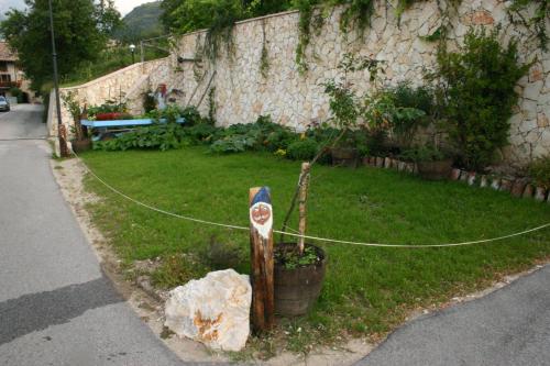 a yard with a rope tied to a house at Casa del Vasaio in Tenno