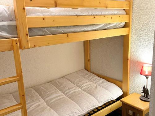a couple of bunk beds in a room at Studio Les Deux Alpes, 1 pièce, 4 personnes - FR-1-516-172 in Les Deux Alpes