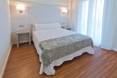 Posteľ alebo postele v izbe v ubytovaní Apartamentos Norte 14