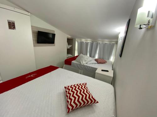 a small room with a bed and a couch at Ancorar Flat Porto de Galinhas-Flat 3311-3314 in Porto De Galinhas