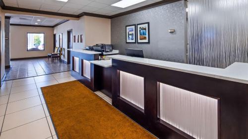 an office lobby with a reception counter and a desk at Best Western Greenville Airport in Greenville