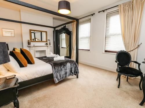 En eller flere senge i et værelse på Quay Cottage