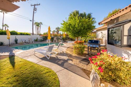 a backyard with a swimming pool and a house at Beautiful Palm Springs Home large private yard in Palm Springs