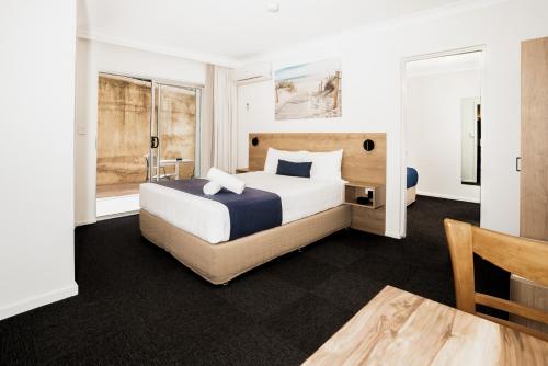 Postel nebo postele na pokoji v ubytování Caribbean Motel