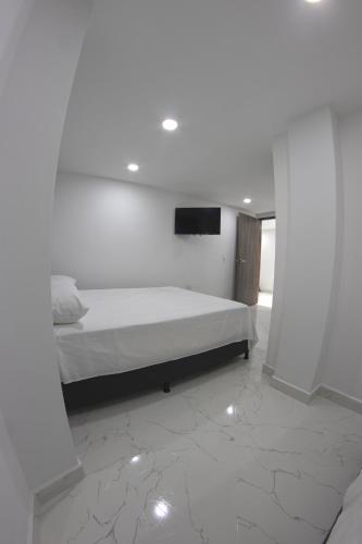 Uma cama ou camas num quarto em Nómada Hospedaje