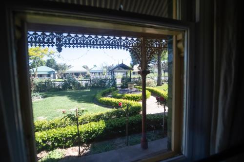 a view from a window of a garden at Avoca House - Gorgeous Federation Home in Mudgee
