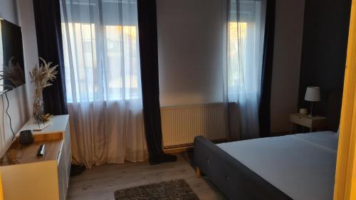 Ένα ή περισσότερα κρεβάτια σε δωμάτιο στο Bulevard Apartments