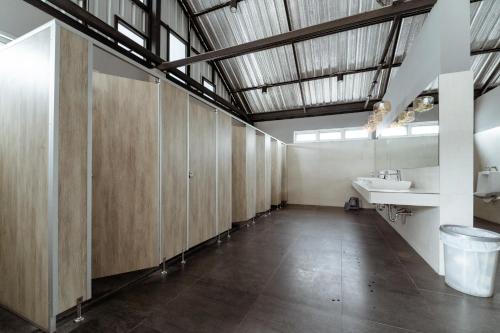 a bathroom with wooden cabinets and a sink at My space69 in Ban Pak Khlong Khwang